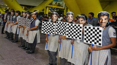 chennai school students hold chess board designed placards to welcome candidate