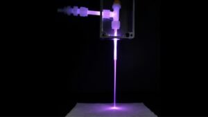 the prototype laundry gun in action during a fabric treatment test
