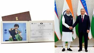 pm modi gifting javokhir sindarovs world cup scoresheet to uzbek prez